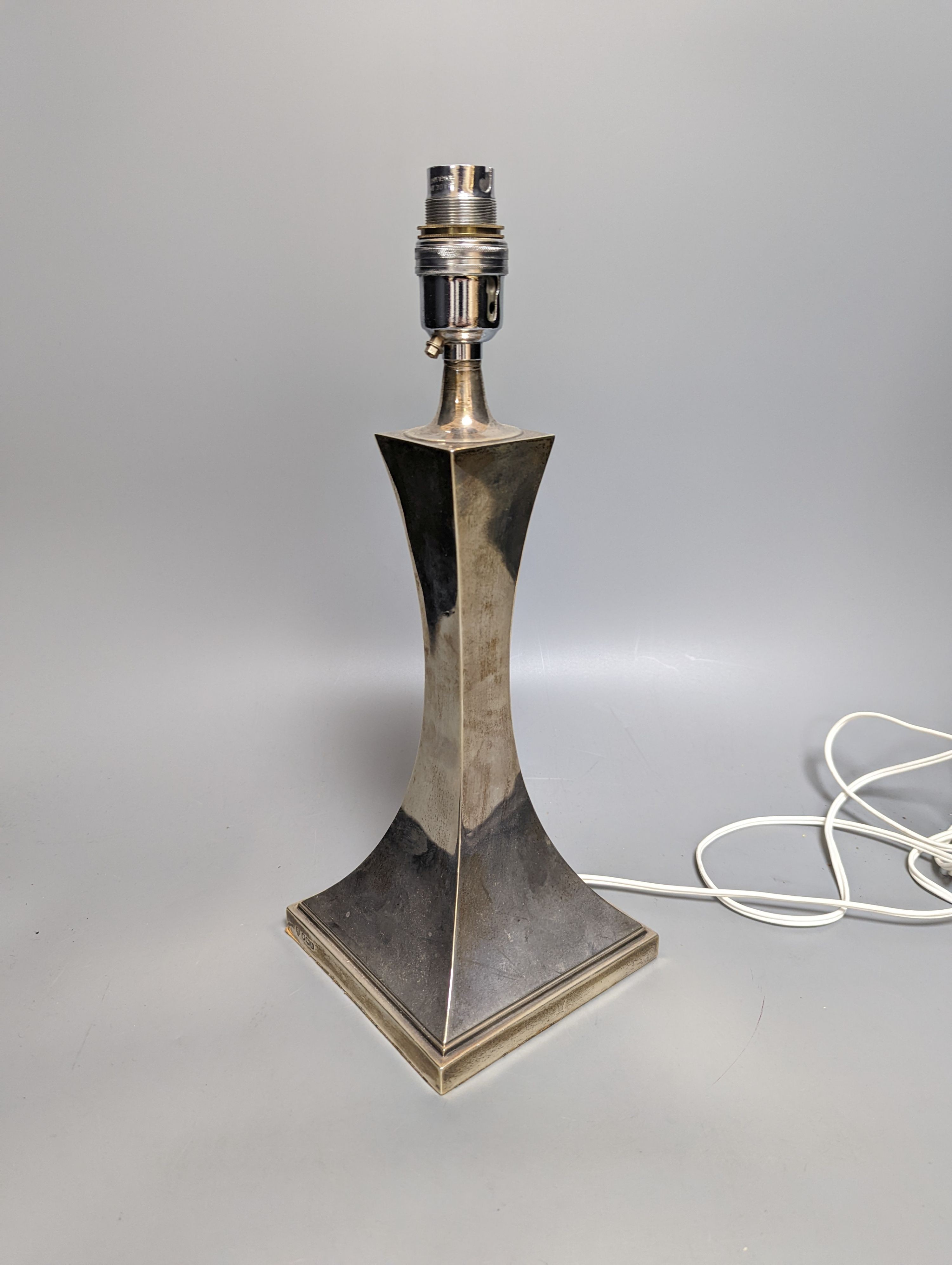 A George V silver lamp base, Hawksworth, Eyre Ltd, Sheffield, 1925, overall height 35cm.